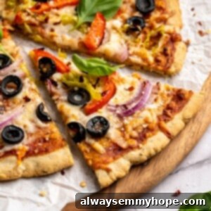 Slice of almond flour pizza pulled away from rest of pizza