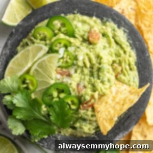Effortless Guacamole 2 Overhead view of guacamole in bowl surrounded by tortilla chips