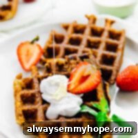 Keto Plant-Powered Waffles 5 Top down view of low carb waffles on a plate.