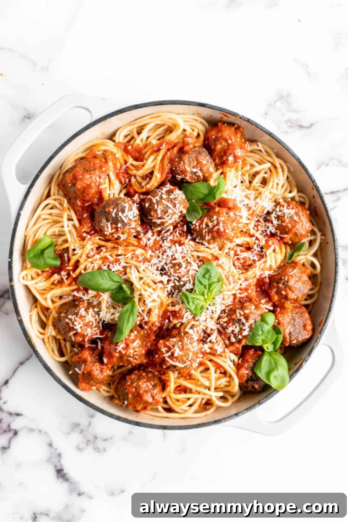 Plant-Powered Spaghetti & Meatballs 12 Pan of vegan spaghetti and meatballs with Parmesan and basil