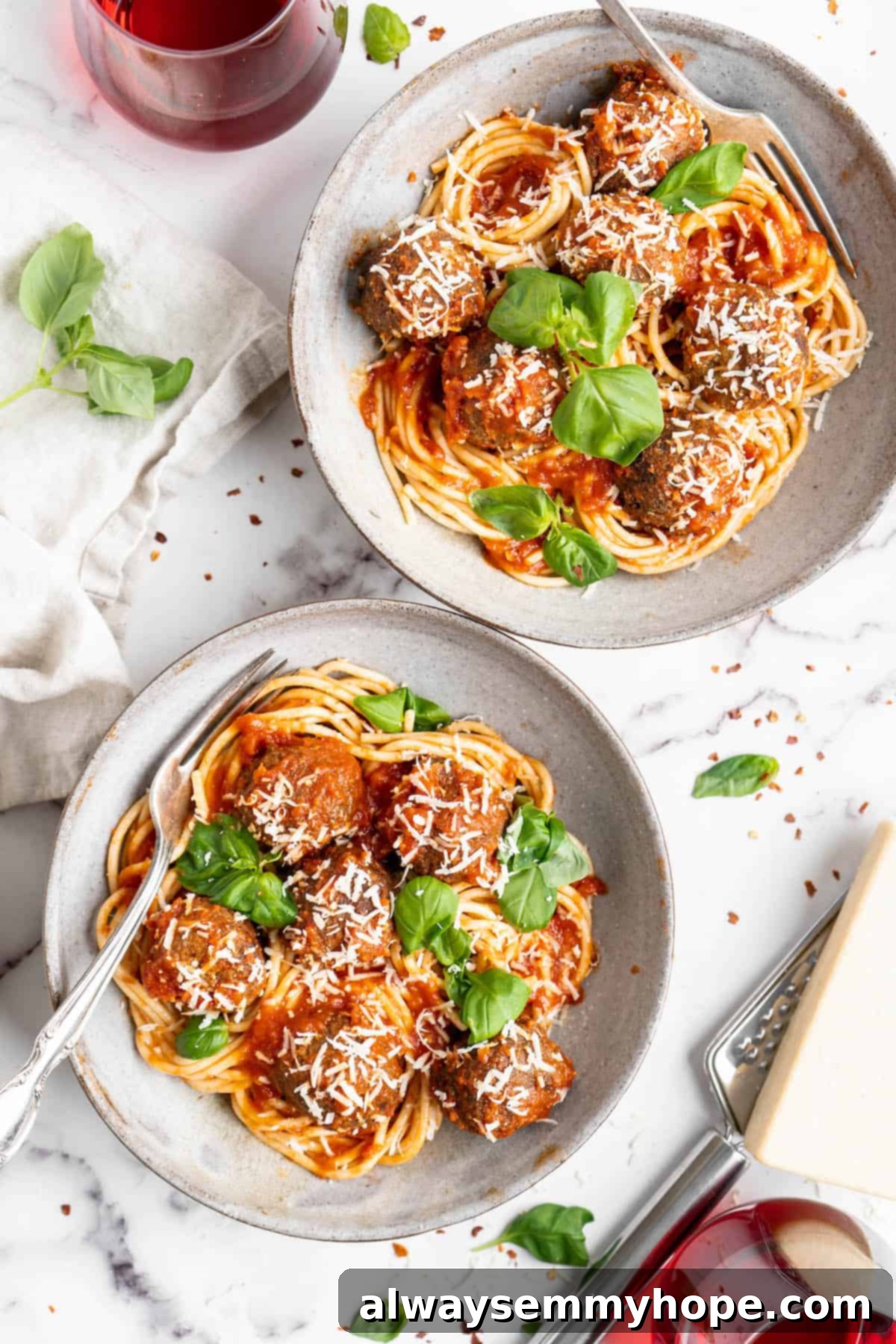Plant-Powered Spaghetti & Meatballs 13 Overhead view of two plates of vegan spaghetti and meatballs