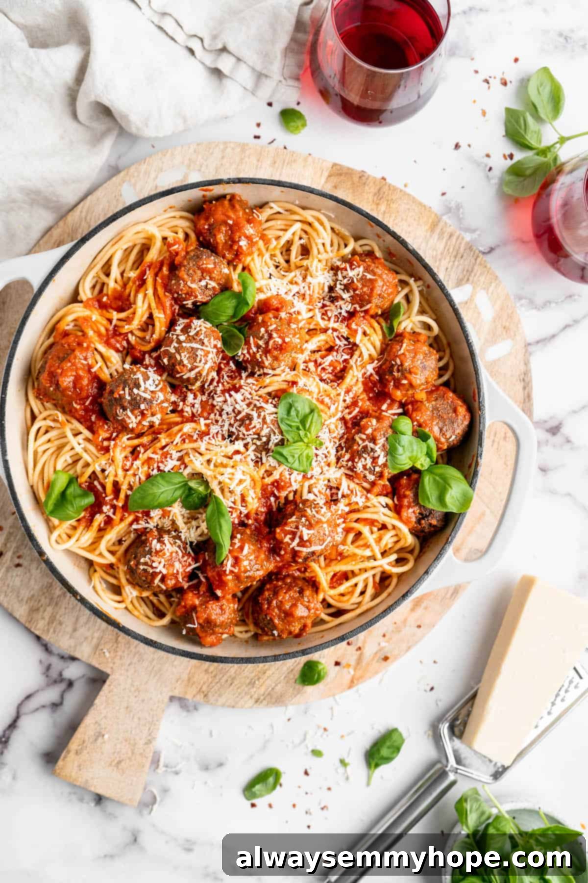 Plant-Powered Spaghetti & Meatballs 14 Pan of vegan spaghetti and meatballs set on wood board