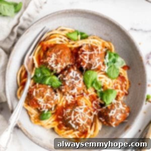 Plant-Powered Spaghetti & Meatballs 16 Overhead view of vegan spaghetti and meatballs on plate with fork