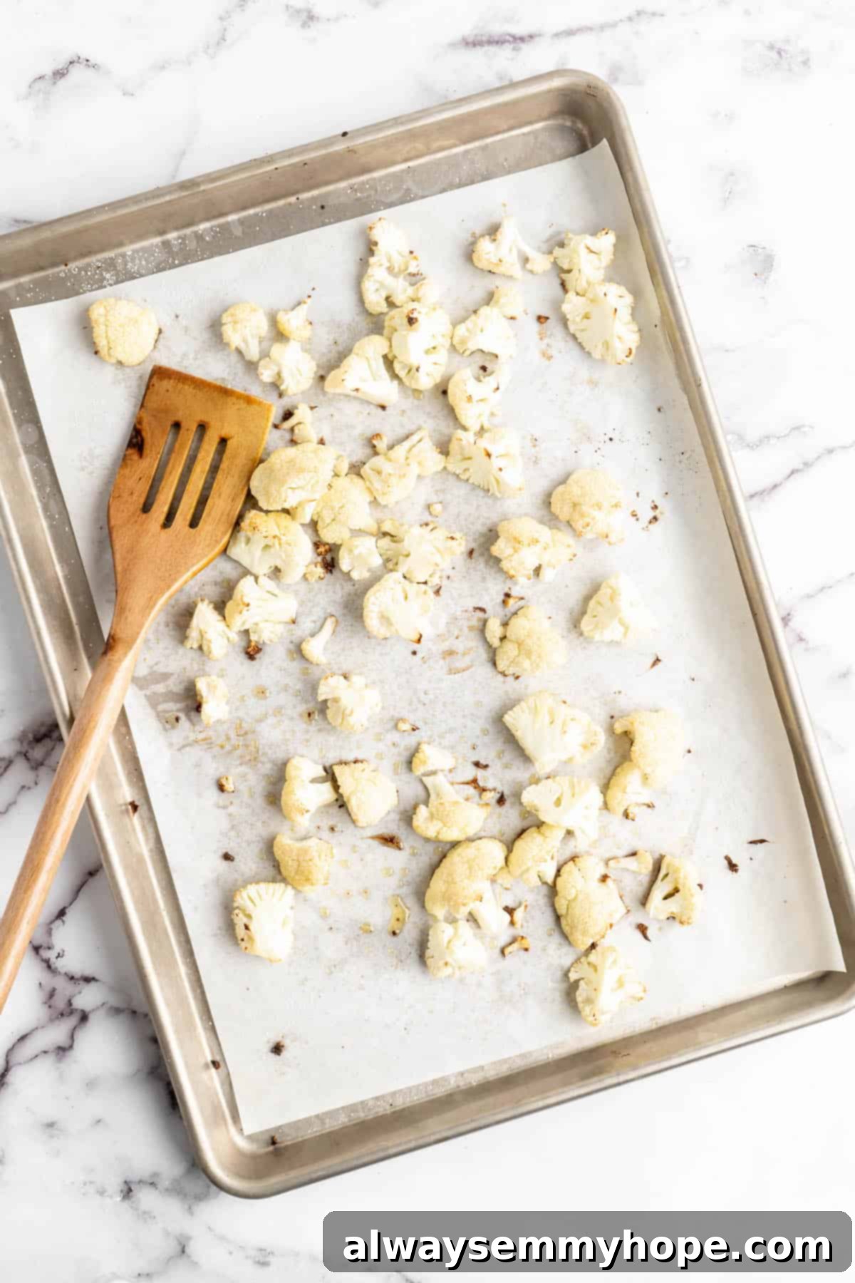Plant-Powered Spaghetti & Meatballs 5 Overhead view of roasted cauliflower on sheet pan
