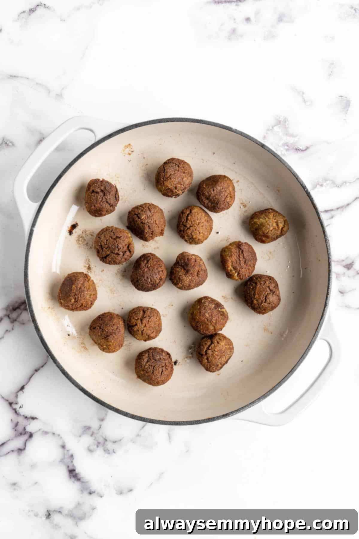 Plant-Powered Spaghetti & Meatballs 10 Overhead view of meatballs cooking in pan