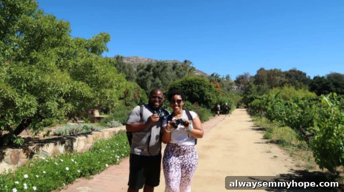 Jessica and Gavin in a field at Rancho La Puerta, a beautiful wellness destination.
