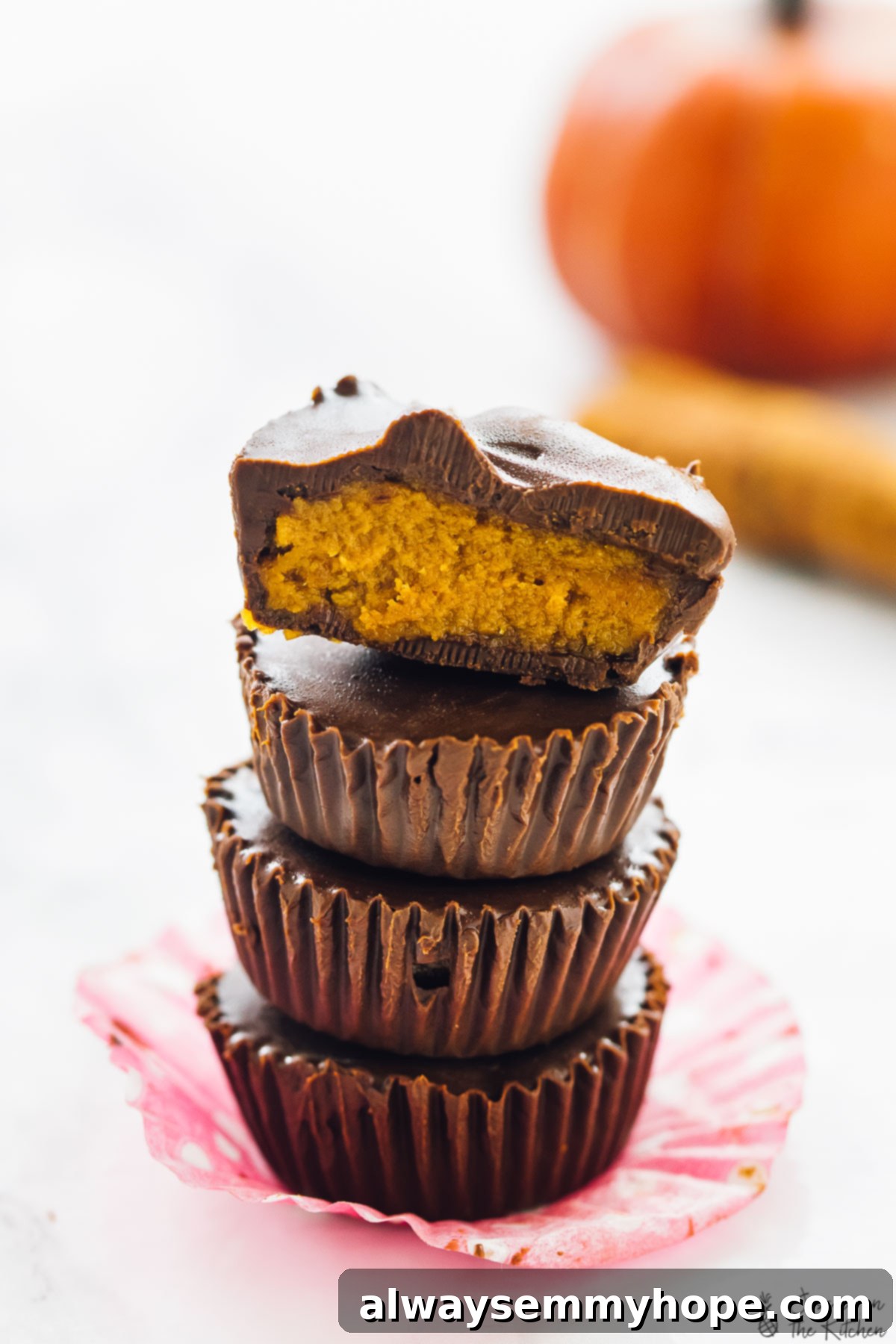 Top 15 Vegan Frozen Treats for Summer Relief 3 A stack of chocolate cups on a pink wrapper.