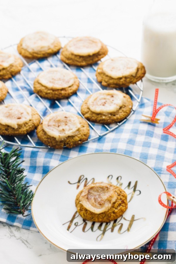15 Irresistible Vegan Pumpkin Recipes for Fall 16 Pumpkin-shaped vegan sugar cookies on a wire rack and a plate.
