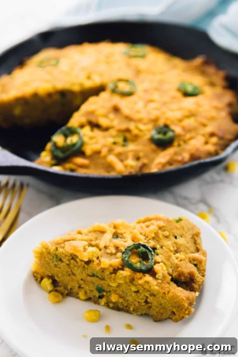 15 Irresistible Vegan Pumpkin Recipes for Fall 6 A slice of vegan cheesy cornbread in front of a skillet of cornbread.