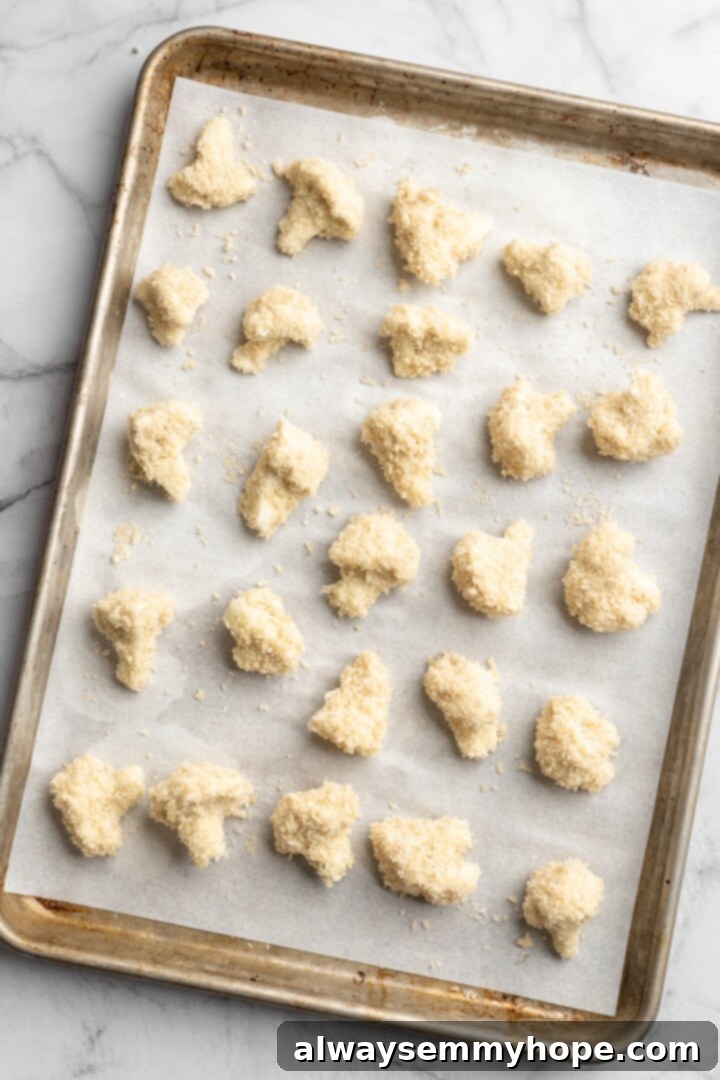 If you love your heat with a side of sweet, these mango habanero cauliflower wings will blow your tastebuds away. An easy crowd-pleaser! Overhead view of cauliflower with batter on sheet pan