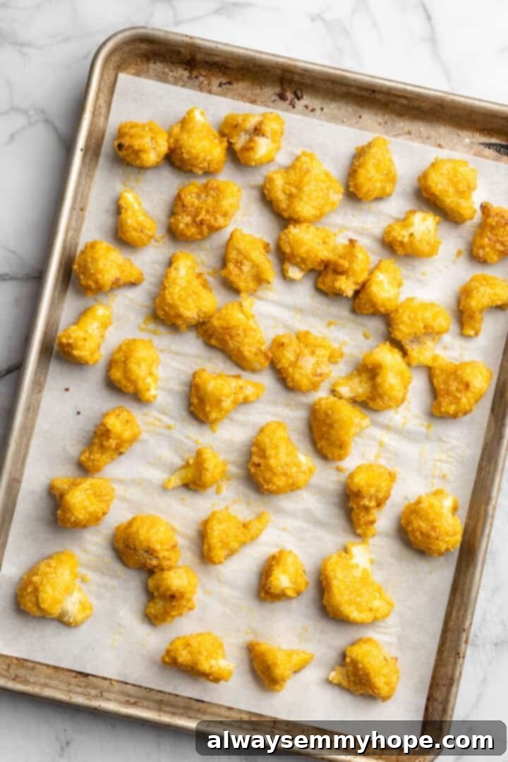 If you love your heat with a side of sweet, these mango habanero cauliflower wings will blow your tastebuds away. An easy crowd-pleaser! Overhead view of mango habanero cauliflower wings on sheet pan