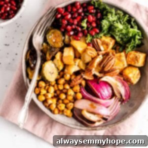 Plant-Powered Buddha Bowl 2 Overhead view of a vegan Buddha bowl on a folded pink napkin with a fork.