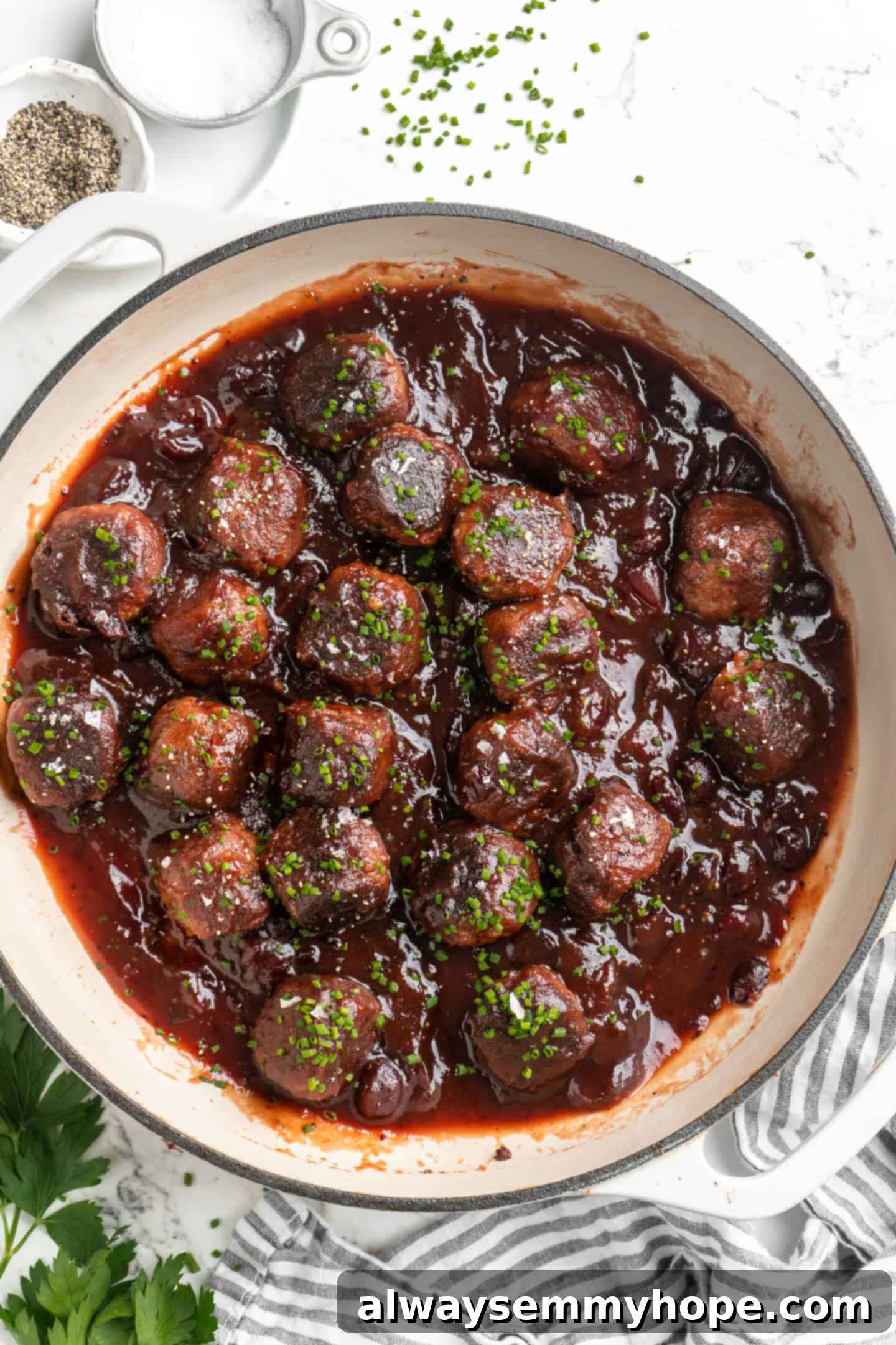 Overhead view of vegan cranberry meatballs in Dutch oven