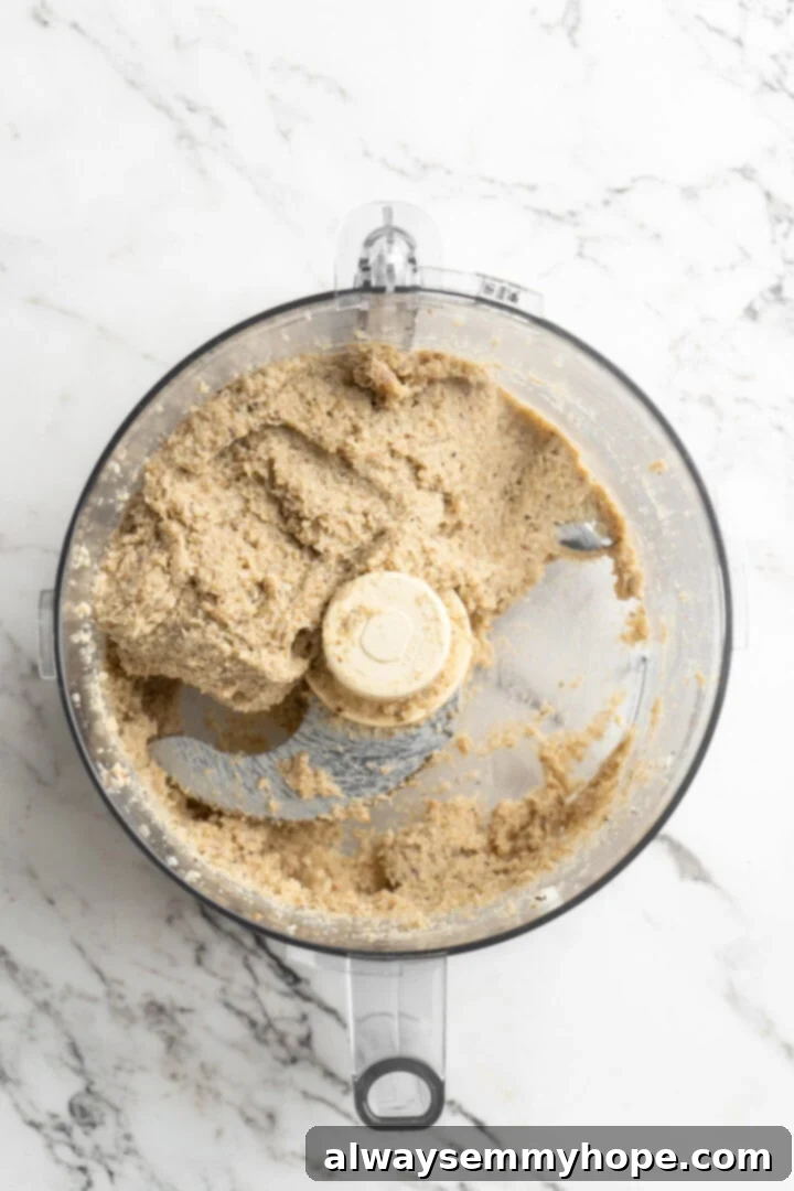 Overhead view of meatball mixture in food processor