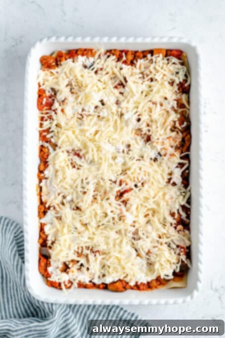 Shredded vegan mozzarella on top of vegan ricotta.