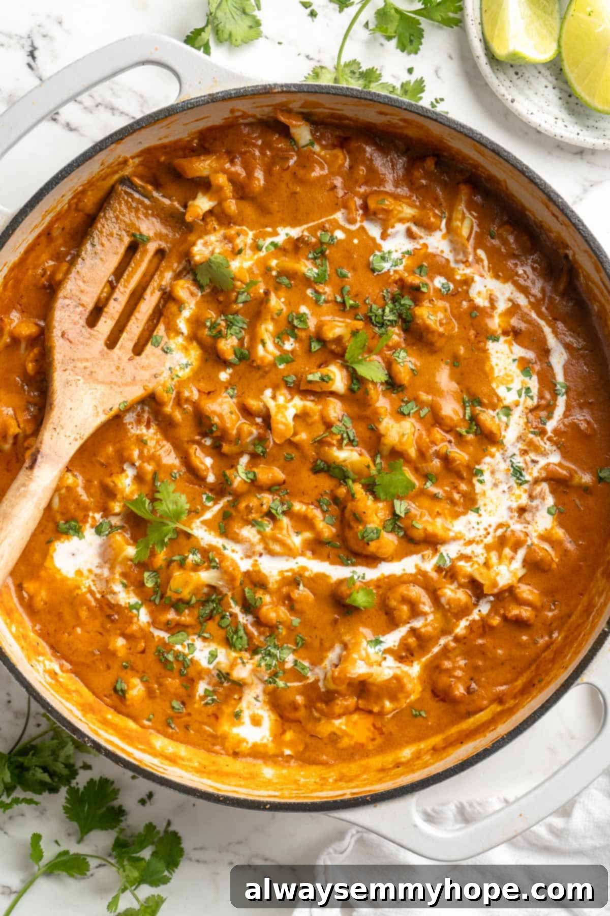 This vegan butter cauliflower starts by marinating the cauliflower in coconut and spices, making it extra delicious. Better than takeout! Pan with creamy butter cauliflower