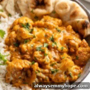 Creamy Butter Cauliflower 2 Bowl of butter cauliflower over rice with naan