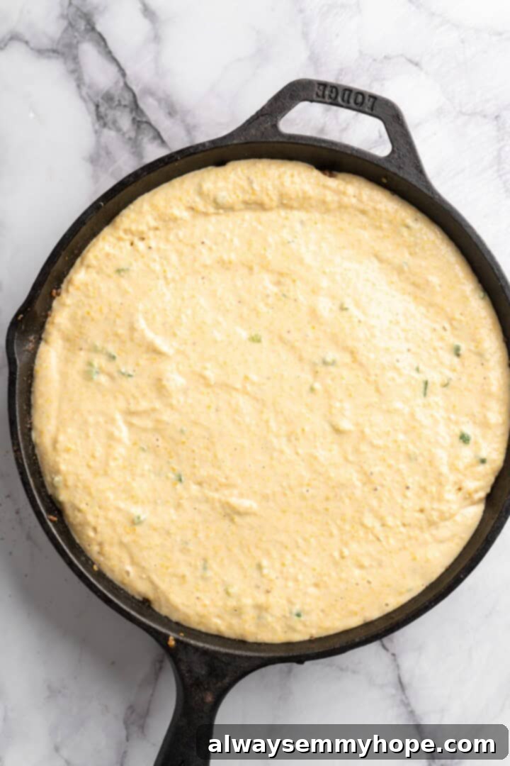 This vegan chili cornbread casserole is one of the BEST casseroles ever! The secret? Sweet, crispy cornbread baked on top of delicious chili. Cornbread topping carefully added to the skillet of simmering chili, creating an even layer