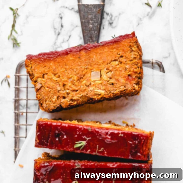 80+ Vegan Thanksgiving Feast Recipes 16 A perfectly glazed vegan meatloaf, sliced and ready to serve, making an impressive plant-based main dish for Thanksgiving.
