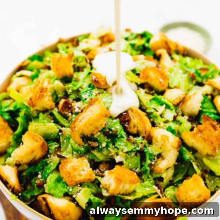 80+ Vegan Thanksgiving Feast Recipes 28 A vibrant vegan Caesar salad topped with crispy coconut bacon, crunchy croutons, and a creamy dressing.