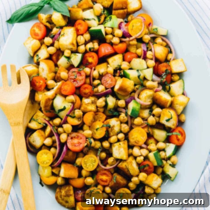 80+ Vegan Thanksgiving Feast Recipes 30 A fresh and vibrant chickpea panzanella salad with crusty bread, tomatoes, cucumber, and herbs.