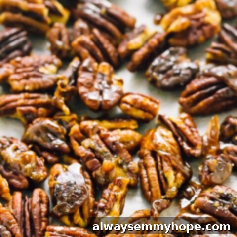 80+ Vegan Thanksgiving Feast Recipes 37 A bowl of glossy, easy stovetop candied pecans, perfect for snacking or topping dishes.