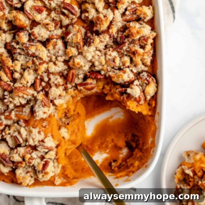 80+ Vegan Thanksgiving Feast Recipes 39 A vibrant skinny sweet potato casserole with a golden-brown maple pecan topping, ready for a healthy holiday feast.