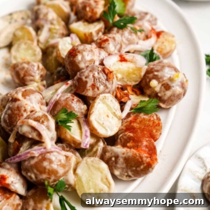 80+ Vegan Thanksgiving Feast Recipes 45 A creamy, rich vegan loaded potato salad, garnished with crispy coconut bacon and fresh chives.