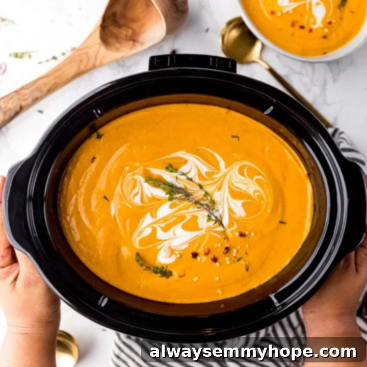 80+ Vegan Thanksgiving Feast Recipes 51 A comforting bowl of vegan pumpkin soup, slow-cooked to creamy perfection and garnished with a swirl of cream and fresh herbs.