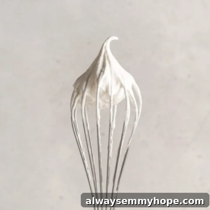 80+ Vegan Thanksgiving Feast Recipes 58 Fluffy, creamy 2-ingredient coconut whipped cream in a bowl, ready to top desserts.