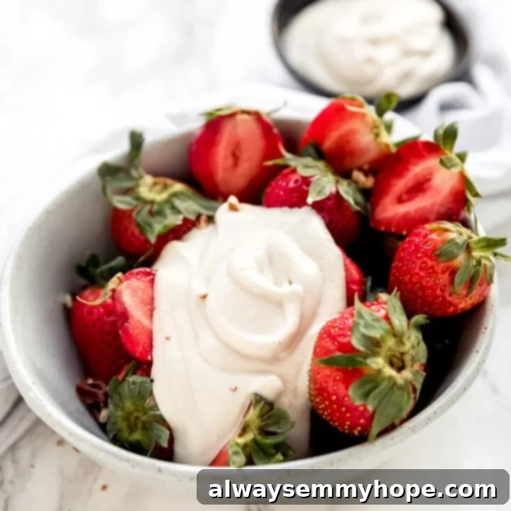 80+ Vegan Thanksgiving Feast Recipes 59 Smooth and creamy vegan cashew whipped cream in a serving bowl, a perfect dairy-free dessert topping.