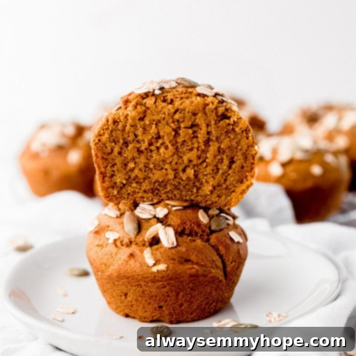 80+ Vegan Thanksgiving Feast Recipes 77 Moist and fluffy vegan pumpkin muffins with a golden-brown top, perfect for a cozy fall treat.