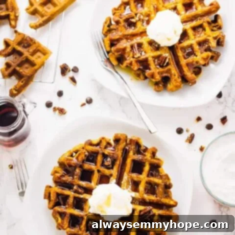 80+ Vegan Thanksgiving Feast Recipes 10 Golden-brown flourless vegan pumpkin waffles stacked and drizzled with syrup, embodying autumn flavors.