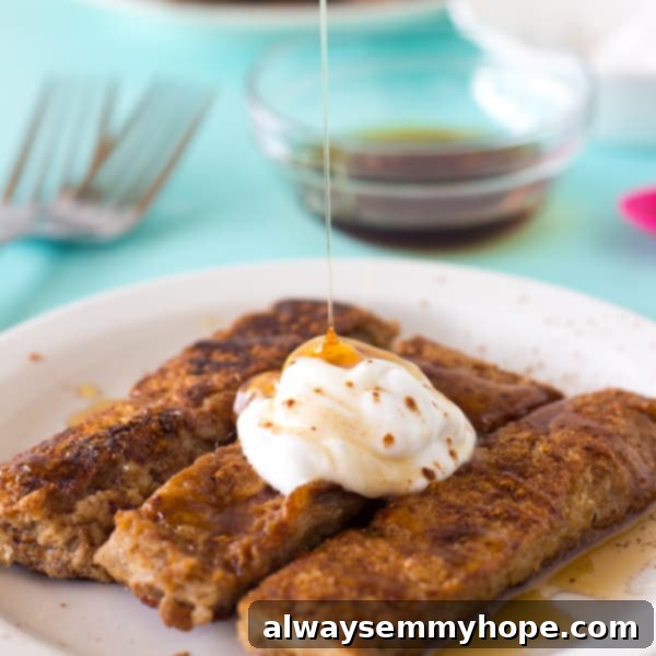 Perfectly golden vegan French toast slices on a plate.