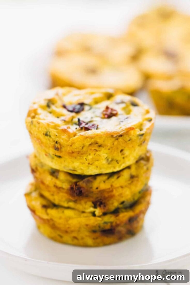 Vegan quiche muffins filled with sun-dried tomatoes and spinach.