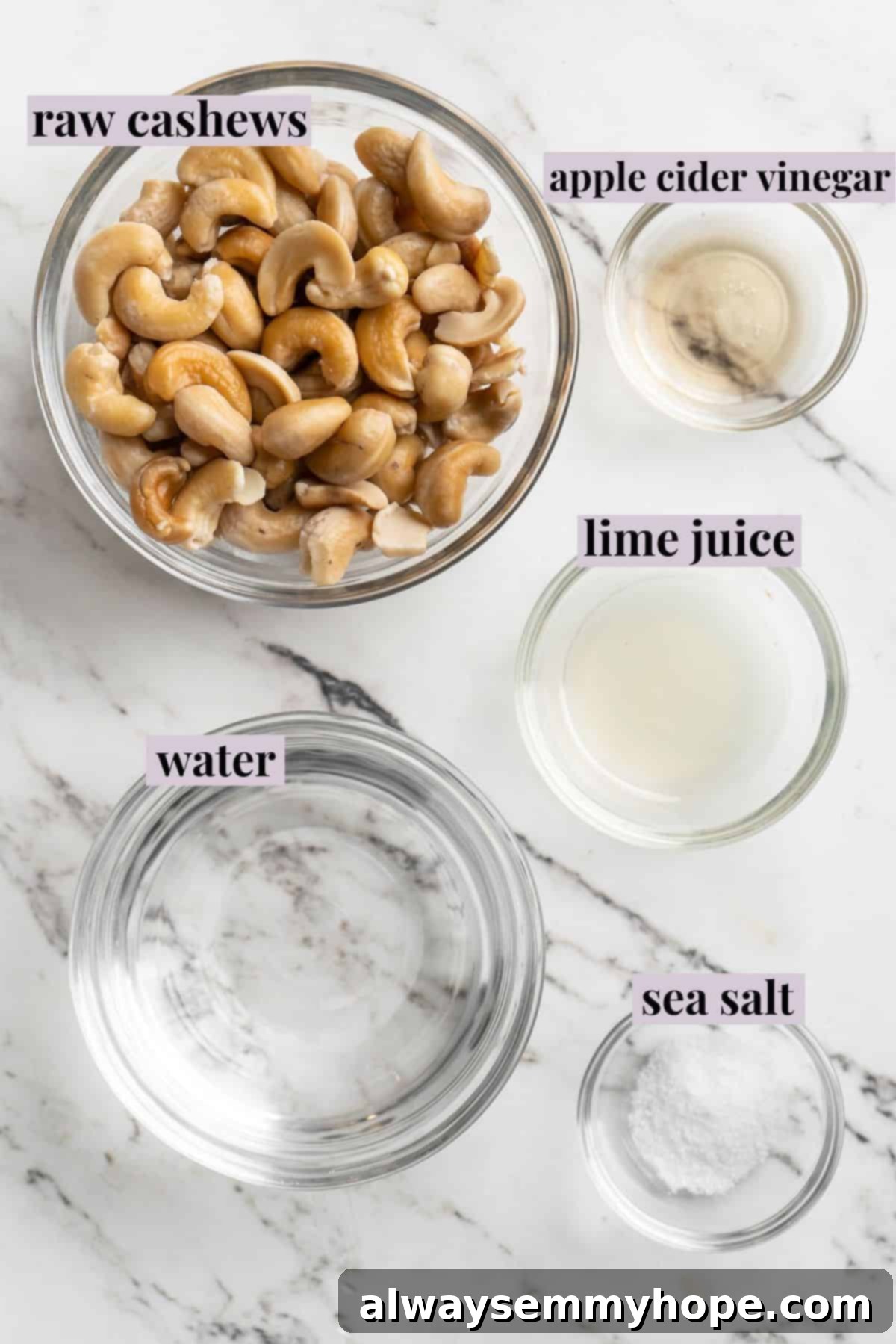 This vegan sour cream recipe is thick, creamy and tangy—and you only need 5 ingredients! Use it all the ways you use traditional sour cream. Overhead view of ingredients for vegan sour cream with labels