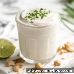 Tangy Vegan Cream 2 Jar of vegan sour cream with chives on top