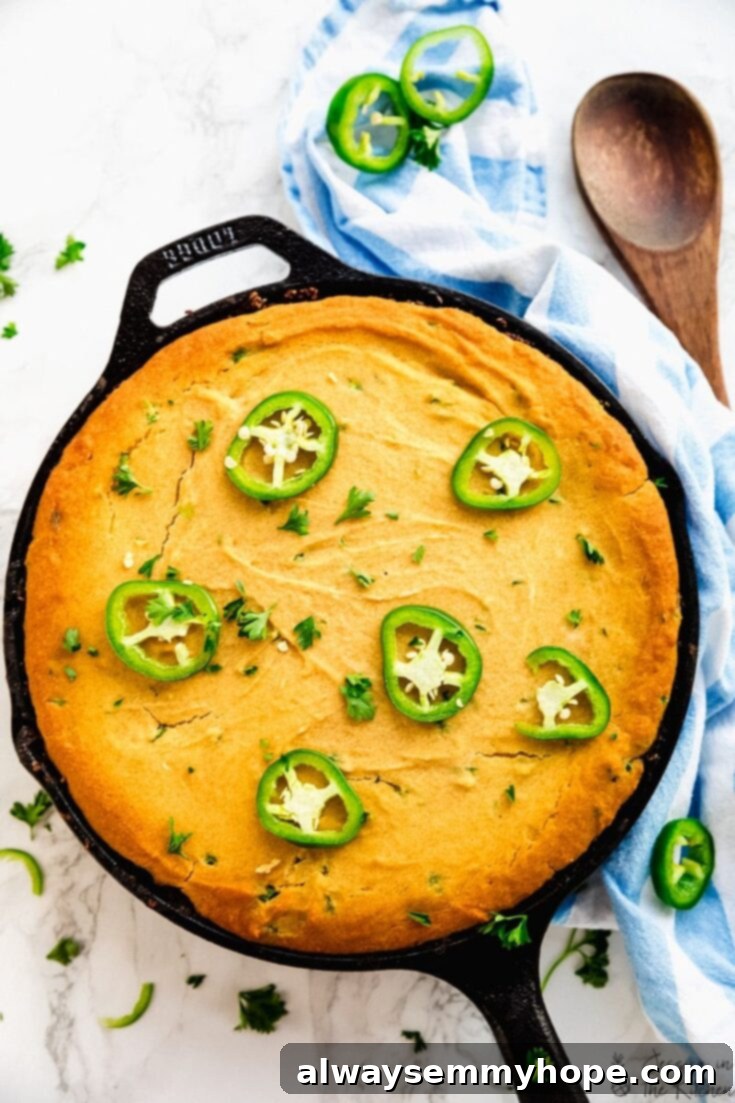 Score Big with 30 Vegan Super Bowl Recipes 29 Vegan Chili Cornbread Casserole in a baking dish, ready to be served.