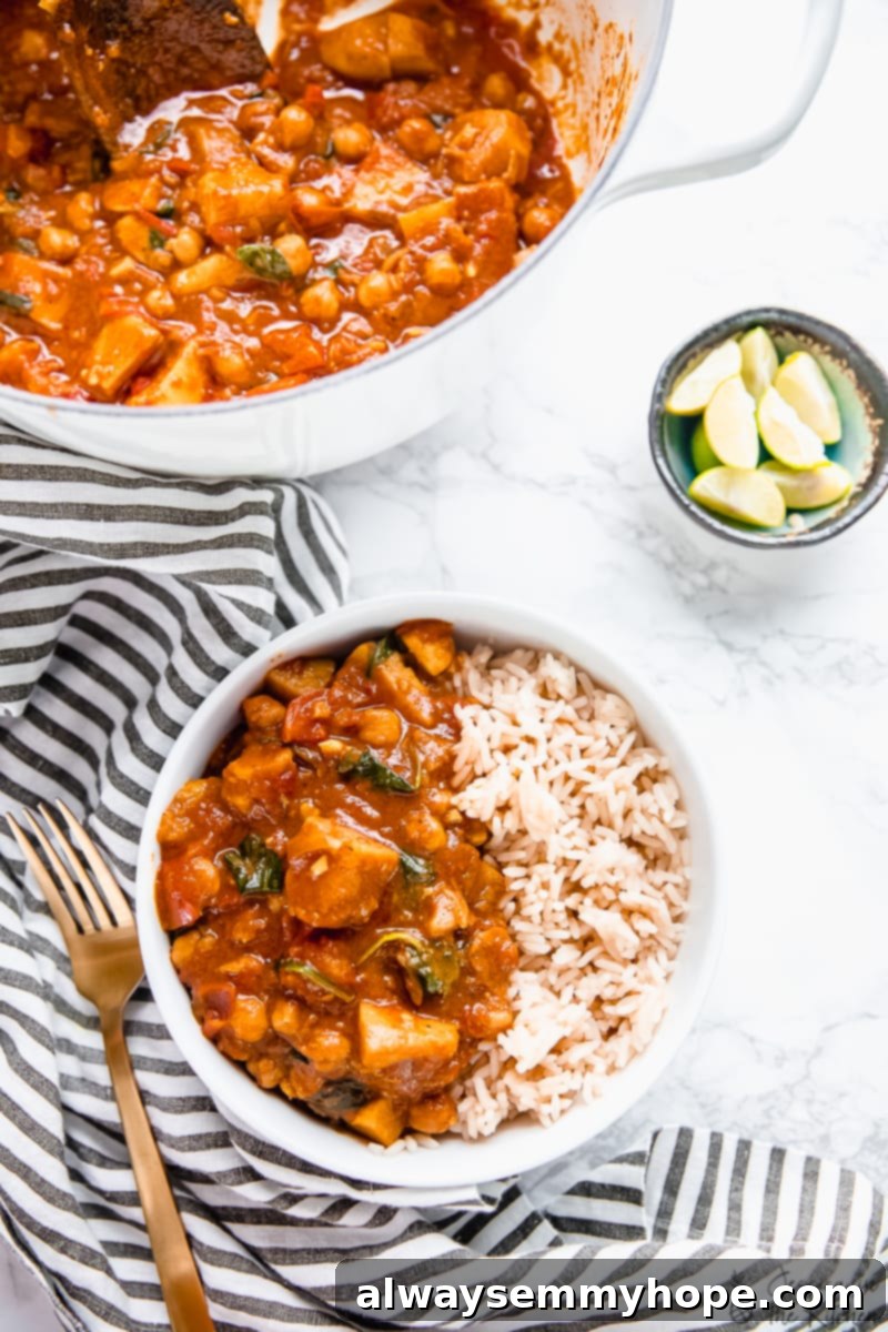 One-Pot Wonder Sweet Potato Curry 2 Hearty one-pot sweet potato and chickpea curry served in a bowl with rice.