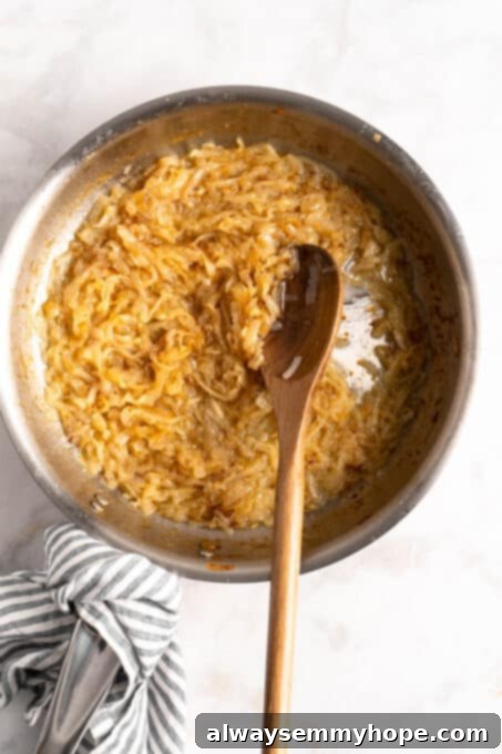 Learn how to caramelize onions the right way for sweet, deeply browned, jammy onions to add to your favorite meals and recipes! Deeply browned, jammy caramelized onions in a skillet, almost ready