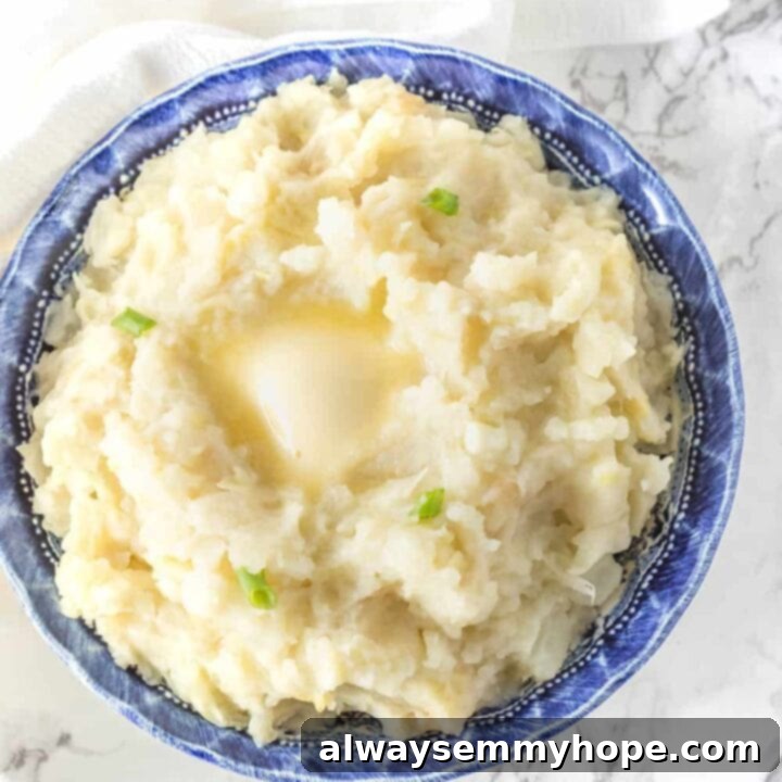 25 Festive Vegan Recipes for St. Patrick's Day 13 Creamy Vegan Colcannon topped with fresh chives, served in a bowl.