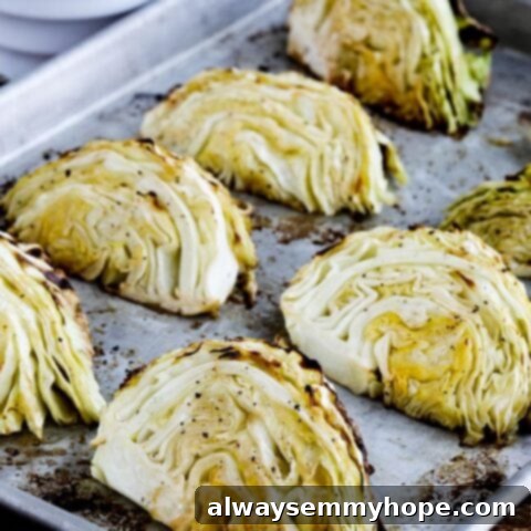 25 Festive Vegan Recipes for St. Patrick's Day 14 Roasted Cabbage with Lemon wedges on a baking sheet.