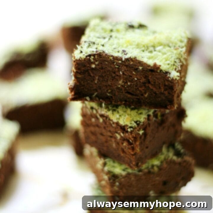 25 Festive Vegan Recipes for St. Patrick's Day 26 Mini Mint Chocolate Brownies (Gluten-Free, Vegan, Allergy-Free) stacked on a plate.