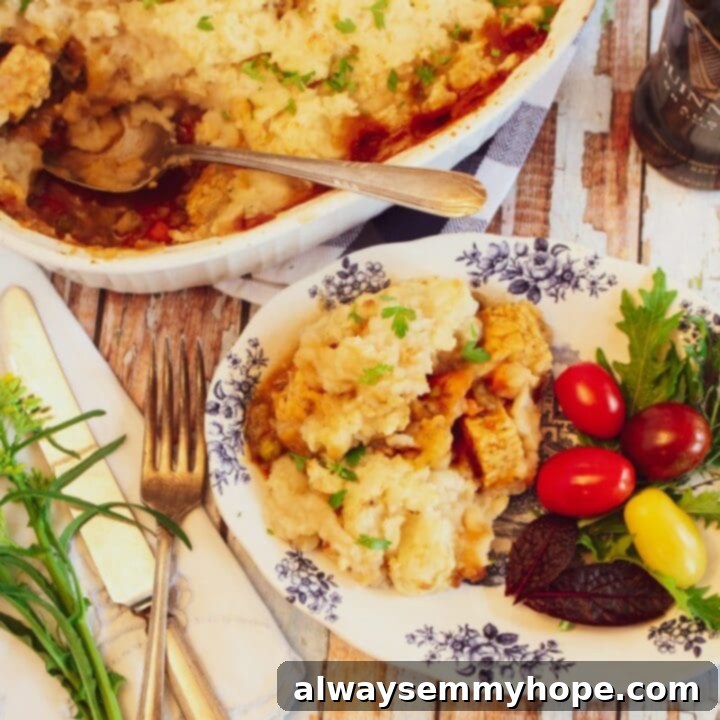 25 Festive Vegan Recipes for St. Patrick's Day 7 Hearty Vegan Guinness Stew in a bowl with a spoon.