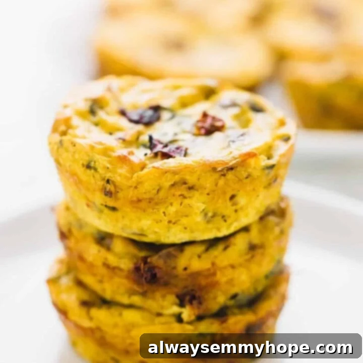 Delicious Vegan Quiche Muffins with sun-dried tomatoes and spinach, baked to golden perfection.
