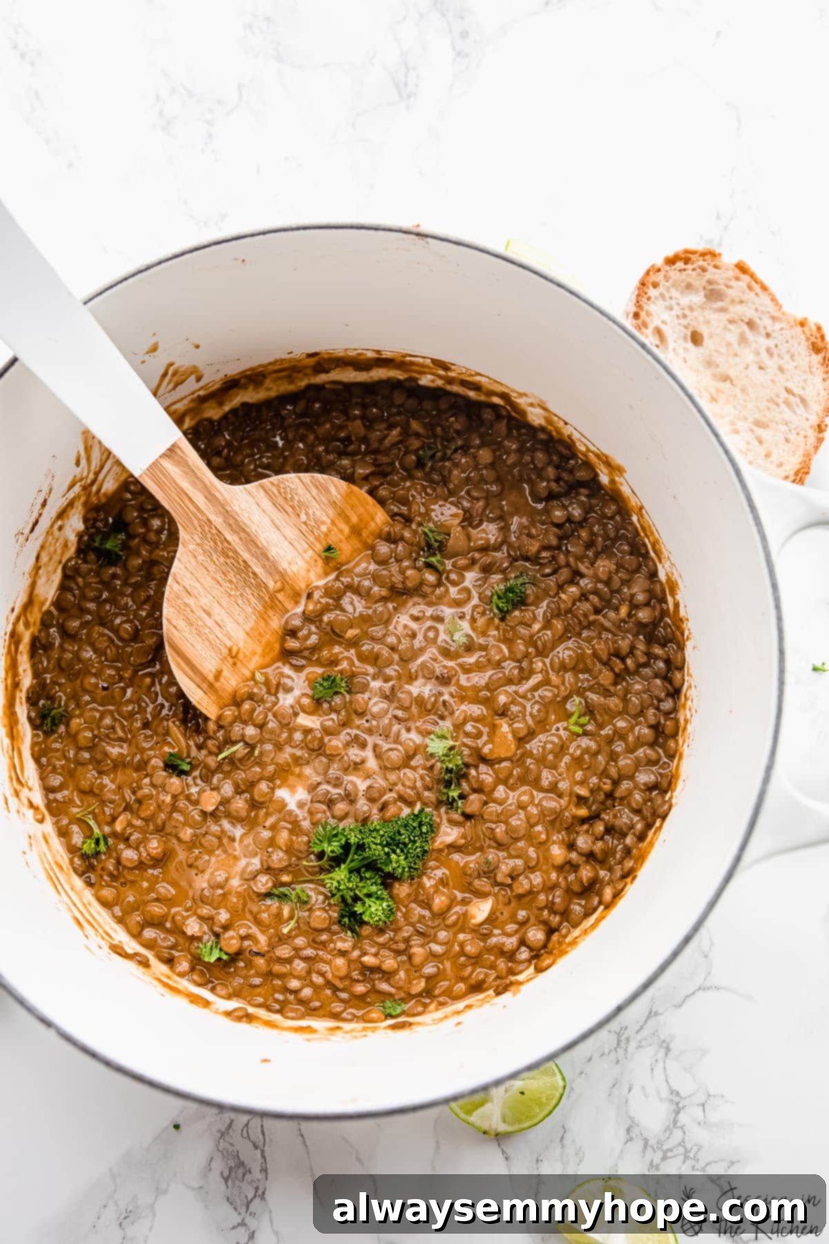 A vibrant pot of vegan lentil stew, steaming gently, ready to be served.