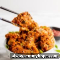 Dynamite Vegan Broccoli 6 Bang bang broccoli being held by chopsticks over a bowl with more broccoli in it.