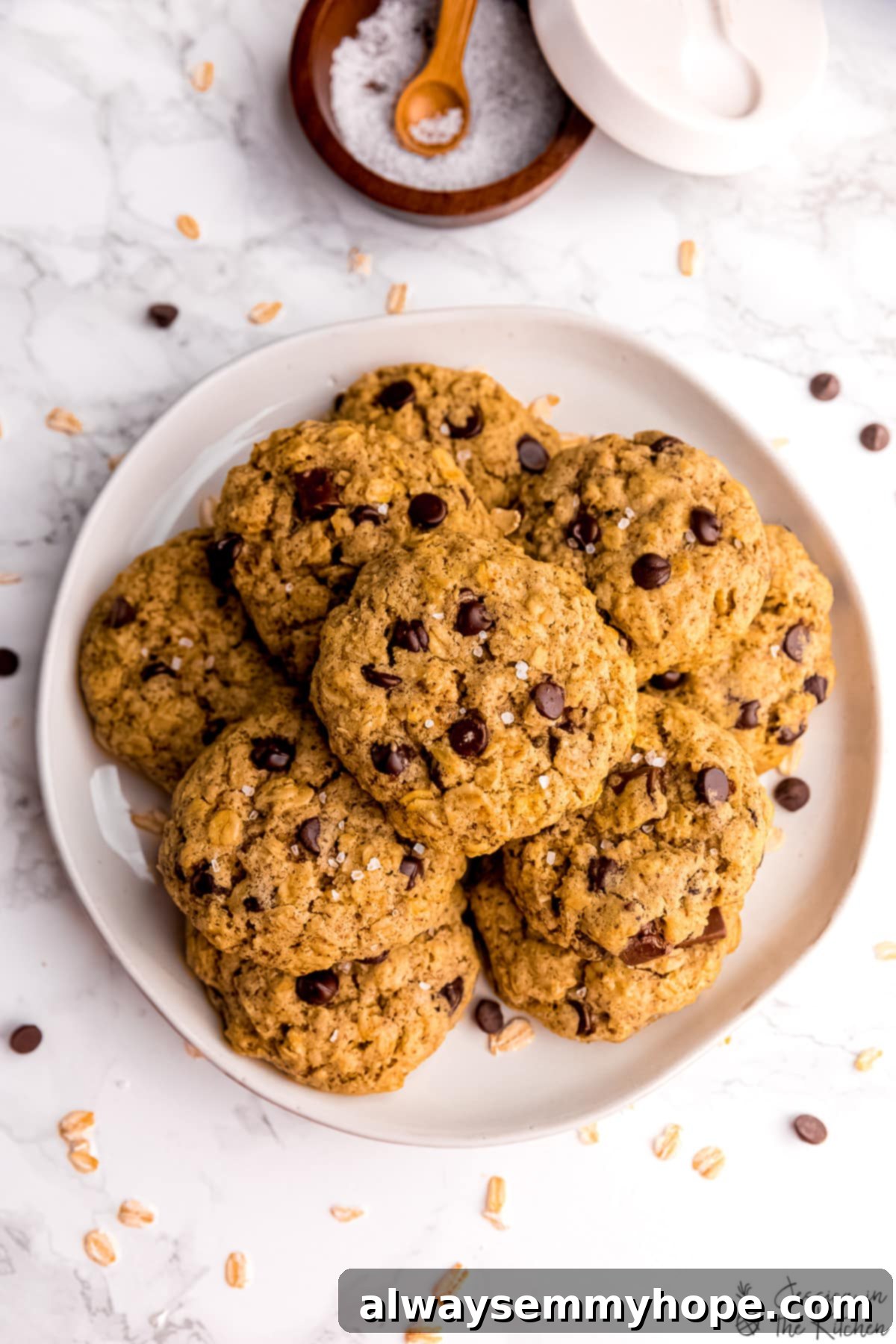 Top down shot of chocolate chip oatmeal cookies on a plate.