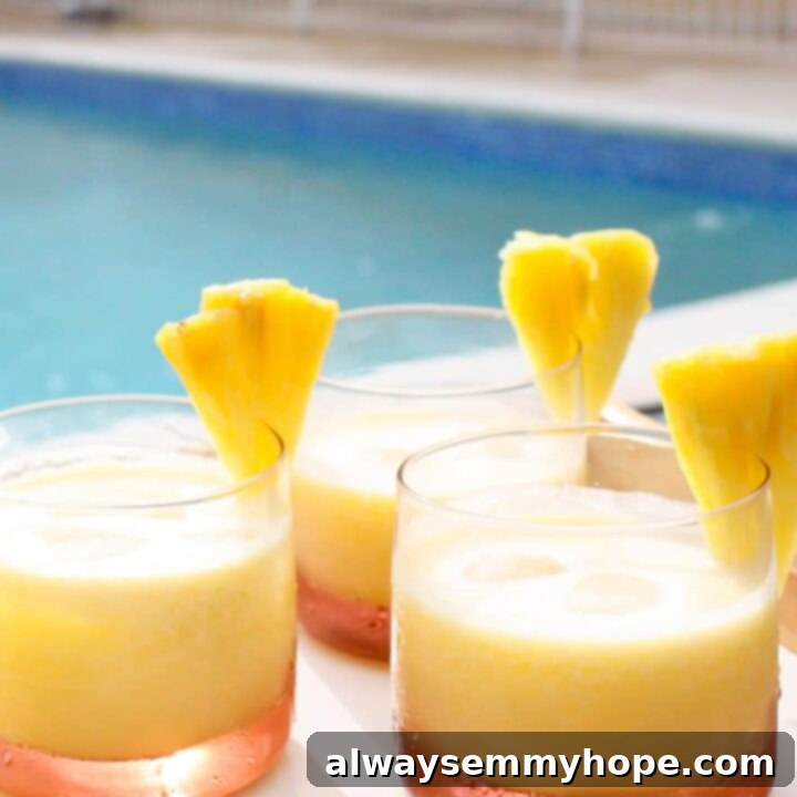 One Can, 20 Vegan Coconut Milk Recipes 10 Refreshing Pineapple Coconut Rum Cocktail with ice and garnishes.