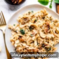 Overhead view of hummus pasta on a plate.